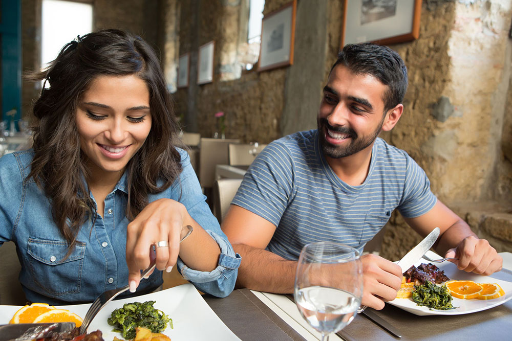 Couple having lunch at rustic gourmet restaurant